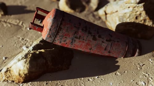 Old Rusted Gas Tank on Sand Beach
