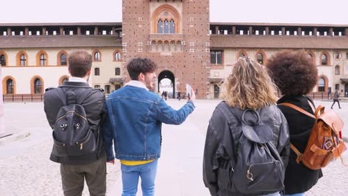 Friends Explore Historic Brick Building in Italy