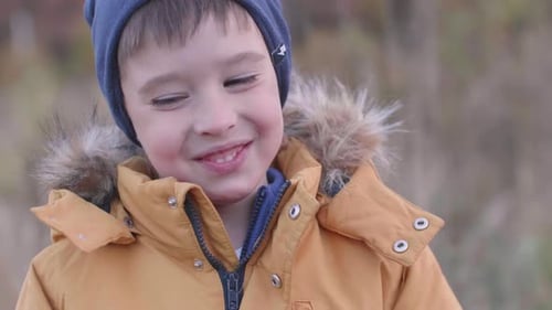 Boy at Field with Dried Grass