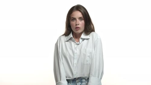 Shocked Young Woman Reacts in Studio