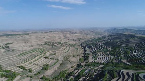 Aerial View of Terraced Farm Field Mass Production During Summer Dry Season