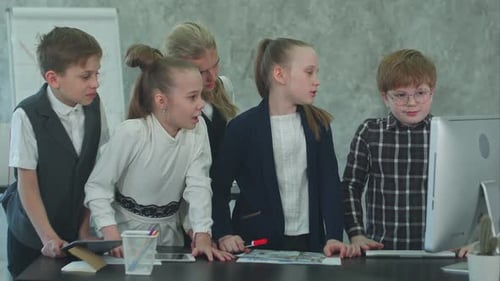 Kid Business Team Working in the Office Together with Computer