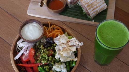 Top View of Nutritious Veggie Lunch Meal on the Table Vegan Bowl Yummy Falafel Roll and Fresh Green