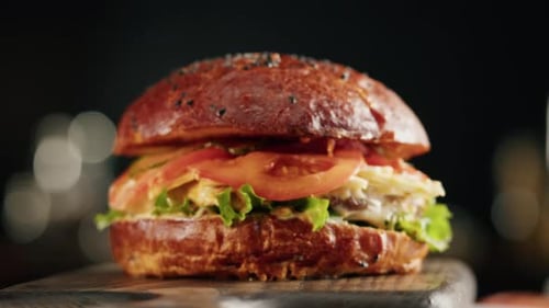 Close Up Burger on Wood Cutting Board
