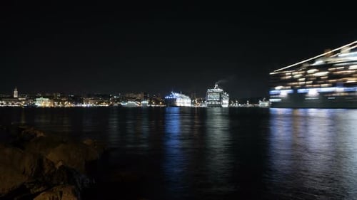 Night timelapse of cruise ships leaving the port