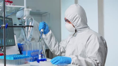 Scientist in Protective Suit Conducts Medical Research
