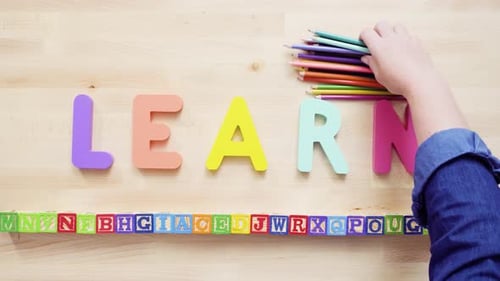 Colorful Learning Tools and Pencils Spell LEARN