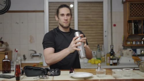 Man Making Cocktail in Kitchen