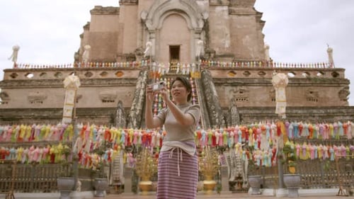 adult mature asian female woman wearing tradition dress tourists travel to the ancient