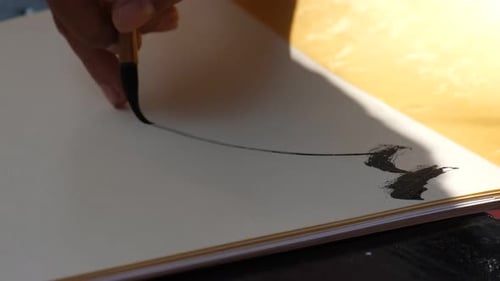 Vietnamese scholar writing calligraphy at lunar new year
