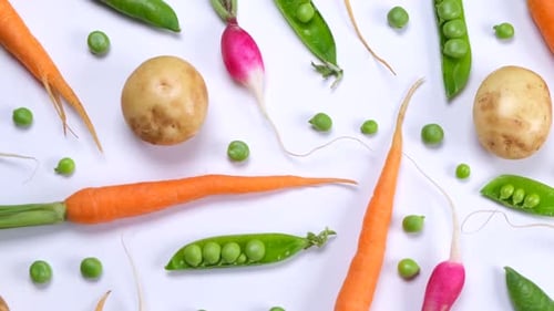 Vegetable Rotating Background of Potatoes Peas Carrots and Radishes Fashionable Vegetable Texture on