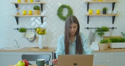 Happy Businesswoman Using Laptop Computer at Home Office in Slow Motion. Cheerful Woman Working