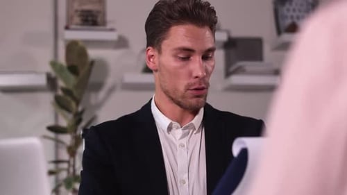 Man Employee Has Interview with Woman Job Applicant at Table in Modern Office Spbi