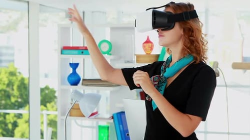 Woman Interacts with Virtual Reality Headset at Workplace