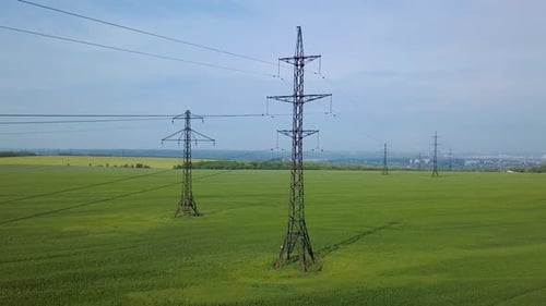 High-voltage Power Pylon on the Green Field