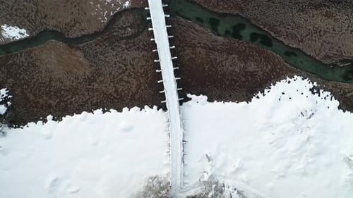 Aerial View of Bridge in Winter Wonderland