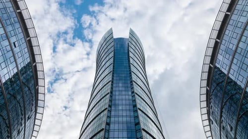 Timelapse Skyscrapers High Office Buildings Facades Blue Sky and Clouds Moving Fast in Timelapse
