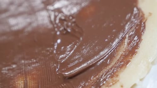 Chocolate topping of tasty sweet ready to be rolled slow-mo 1920X1080 HD tilting footage - Slow mo