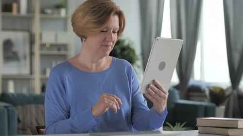 Woman Using Tablet for Video Call at Home