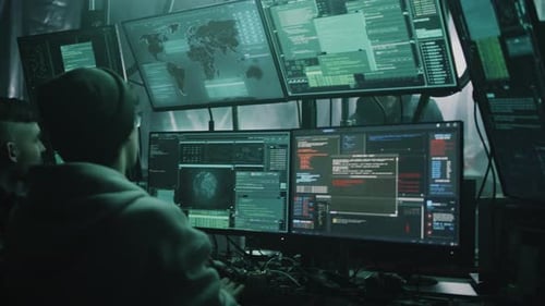 Hackers Working in Dark Computer Room