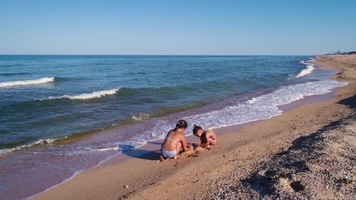 Girls are building a sand castle