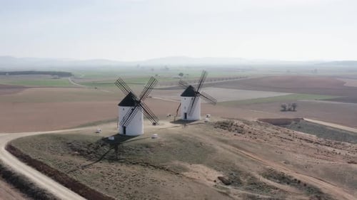 From above white windmill on field