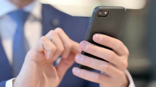 Close Up of Businessman Using Smartphone