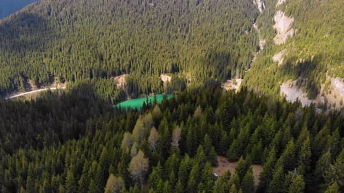Mountain lake with turquoise water and green trees. Mountains, forest and lake.