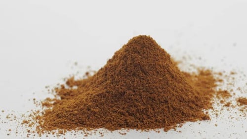 Pile of Aromatic Brown Spice Powder