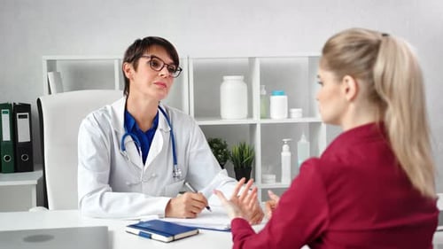 Doctor Consults Patient in Medical Office