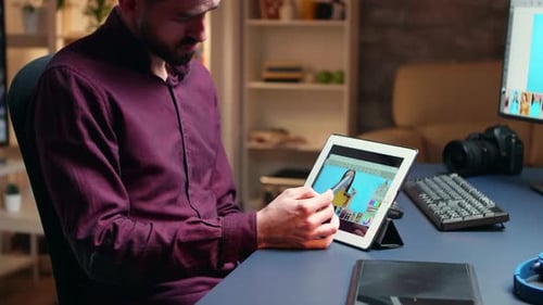 Side View Photographer Doing Retouching on Tablet Computer