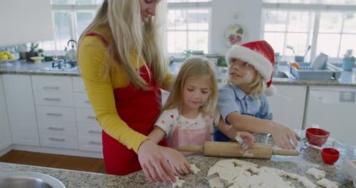 Family Baking Christmas Cookies in Bright Kitchen