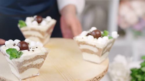 Gourmet Desserts Topped with Whipped Cream and Mint