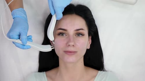 Woman Receiving Facial Treatment in a Beauty Clinic