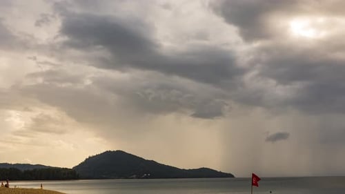 Storm Clouds Over Beach at Sunset