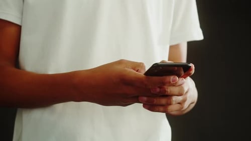 Adult Using Mobile Device Tapping Screen Close Up