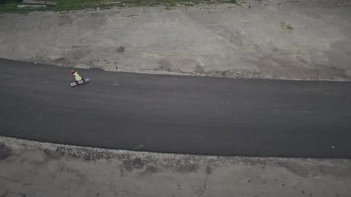 Child Skating on Road from Aerial View