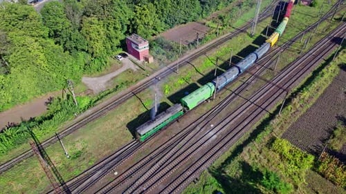 Vintage Cargo Train Traveling through Rural Countryside