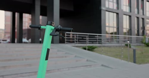 Attractive woman take electric bike walking on street modern town.