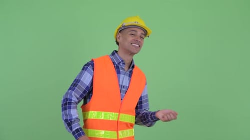 Happy Construction Worker Dancing in Front of Green Screen
