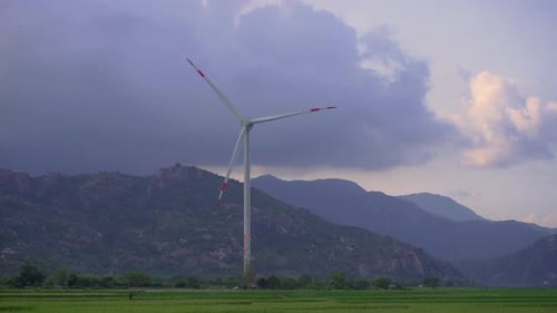 Wind Turbine Spinning in Rural Mountain Landscape
