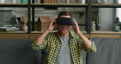 Man Using Virtual Reality Headset at Home
