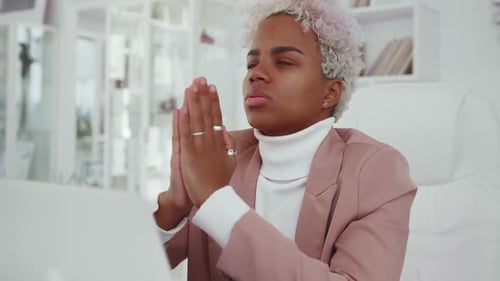 Young Believer in God African American Business Woman Praying with Palms Clasped