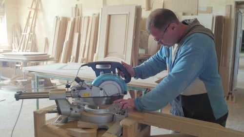 Man cutting wood