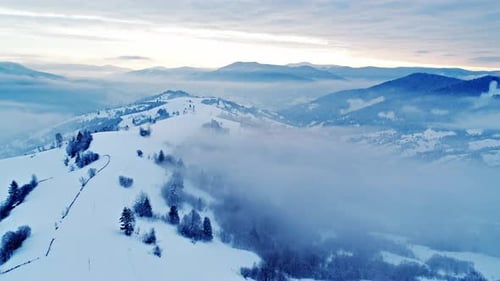 Aerial View in Foggy Sunset Winter Mountain