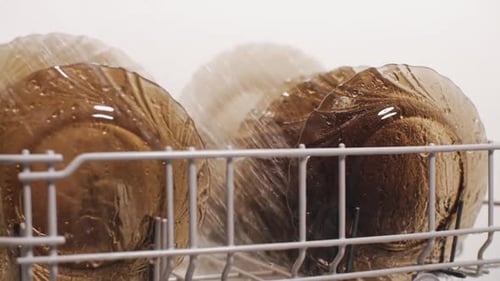Dishwasher Washing Glass Plates Close Up