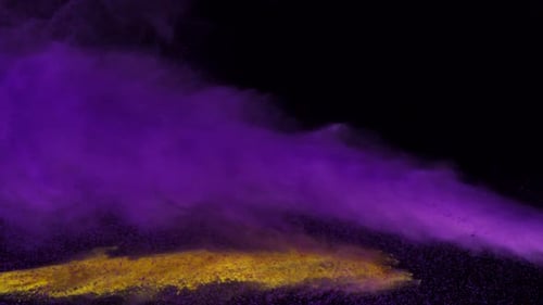 Purple and yellow powder colliding in the air, Slow Motion