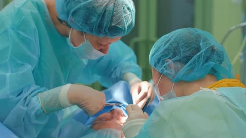 Medical Professionals Performing Surgical Procedure in Hospital