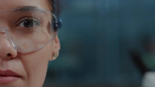 Female Scientist Wearing Safety Glasses, Close Up