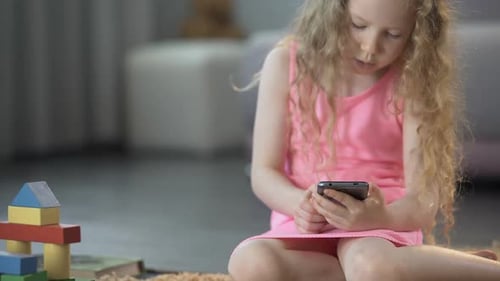 Girl Using Smartphone at Home
